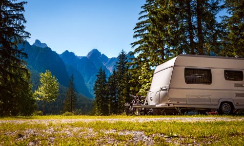 Family vacation travel, holiday trip in motorhome, Caravan car Vacation. Beautiful Nature Italy natural landscape Alps.